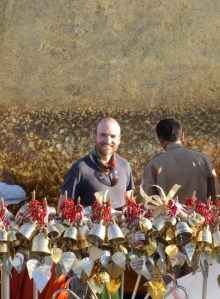 Dean rubbing the gold leaf onto the rock